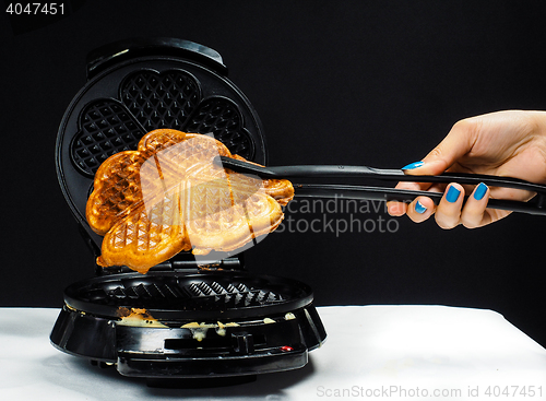 Image of Person making fresh waffles