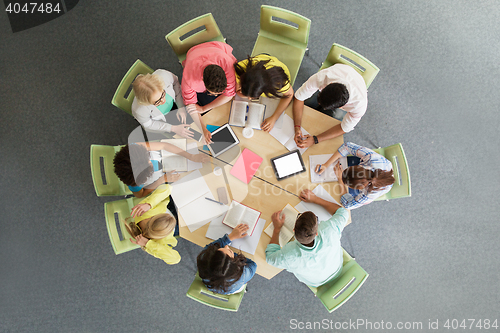 Image of group of students with tablet pc at school library