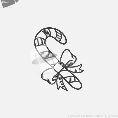Image of Candy cane with christmas decoration sketch icon.