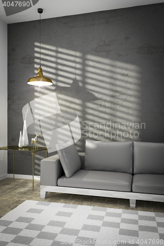 Image of living room with a sofa and sunlight on the wall