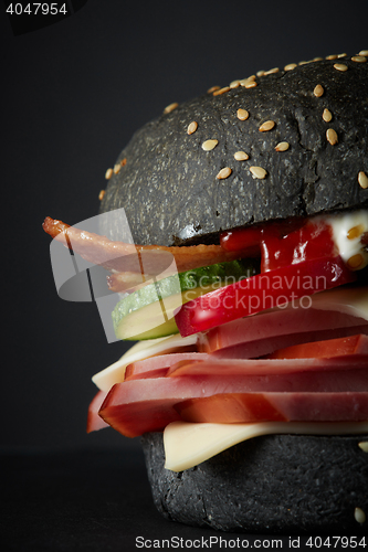 Image of Gourmet black burger with Spicy sauce