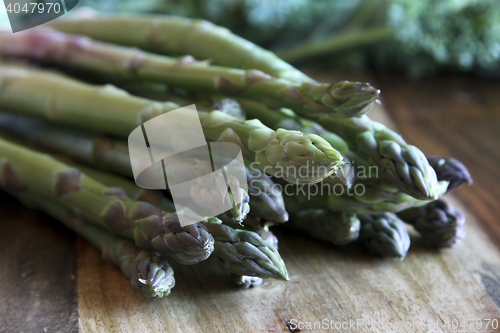 Image of Asparagus on wooden block