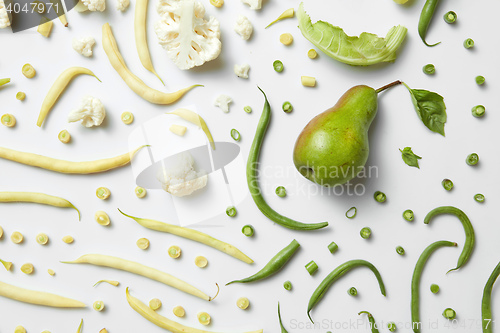 Image of pear, cauliflower and beans on white background