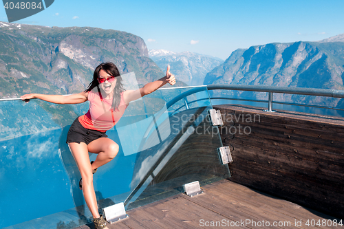 Image of Excited woman tourist at Stegastein Viewpoint