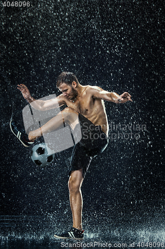 Image of Water drops around football player under water