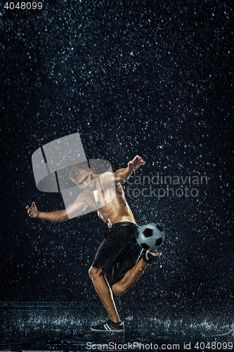 Image of Water drops around football player under water