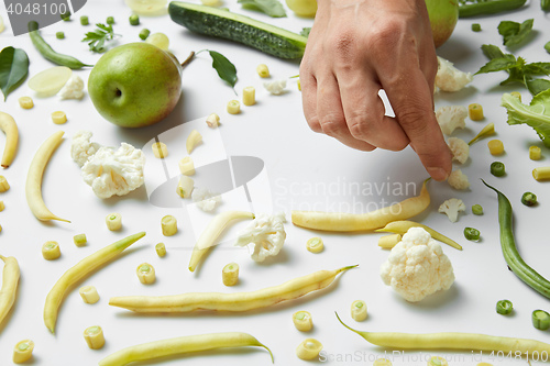 Image of pear, cauliflower and beans on white background