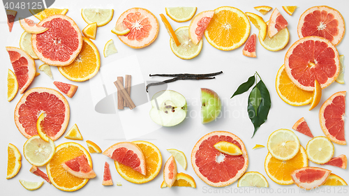 Image of set of citrus fruit with leaves on white background