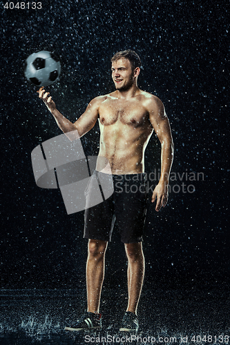 Image of Water drops around football player under water