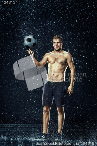 Image of Water drops around football player under water