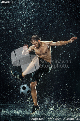 Image of Water drops around football player under water