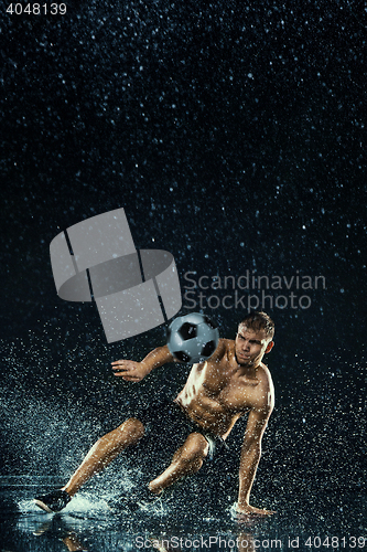 Image of Water drops around football player under water