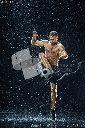 Image of Water drops around football player under water