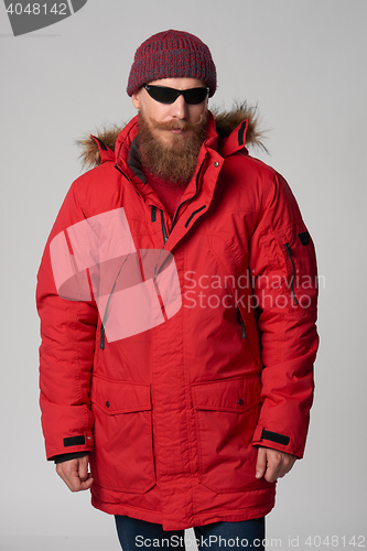 Image of Man wearing red winter Alaska jacket