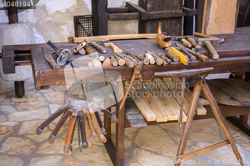 Image of Vintage woodworking tools on a wooden workbench