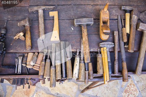 Image of Vintage woodworking tools on a wooden workbench