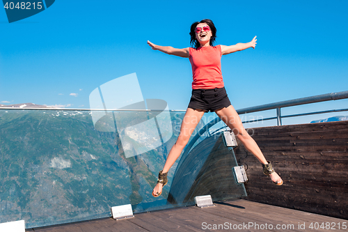 Image of Excited woman tourist at Stegastein Viewpoint