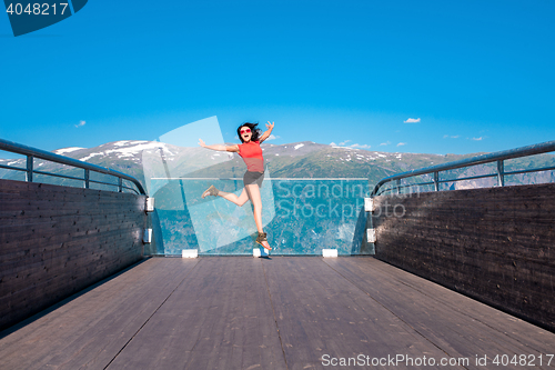 Image of Excited woman tourist at Stegastein Viewpoint