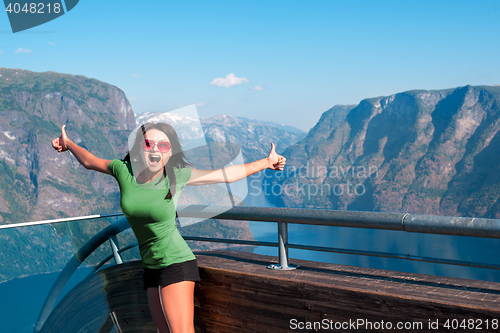 Image of Excited woman tourist at Stegastein Viewpoint