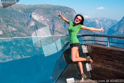 Image of Excited woman tourist at Stegastein Viewpoint