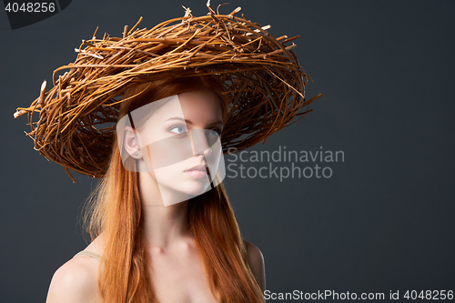 Image of Beautiful woman in natural wreath