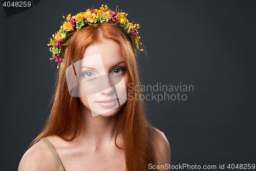 Image of Beautiful red haired woman in flower wreath