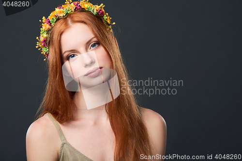 Image of Beautiful red haired woman in flower wreath