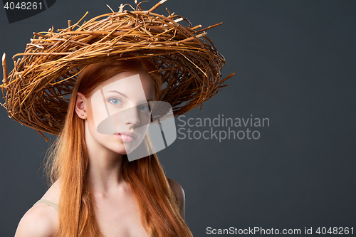 Image of Beautiful woman in natural wreath