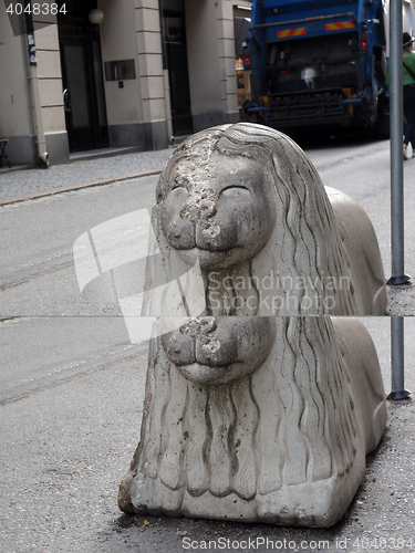 Image of iconic lion statue main shopping street Drottninggatan in Stockh