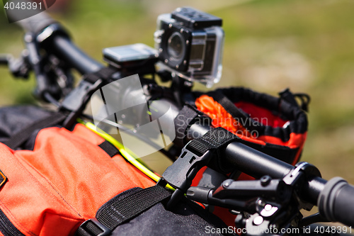 Image of Bicycle with orange bags for travel