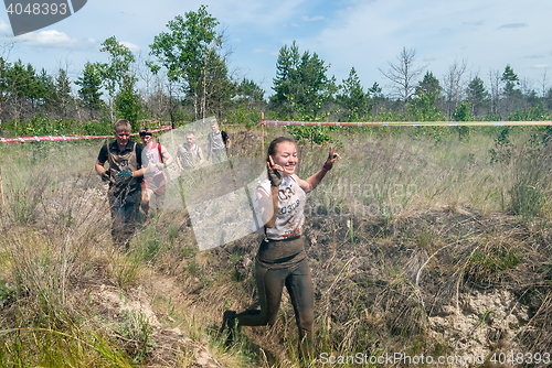 Image of Sportsmen run between stages in extrim race.Tyumen