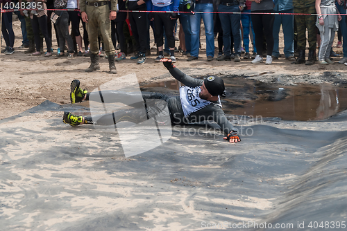 Image of Sportsman storms big wall in extrim race. Tyumen