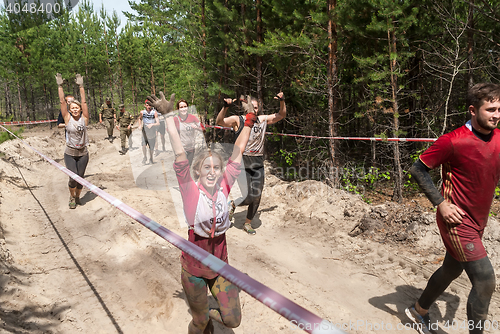 Image of Sportsmen run between stages in extrim race.Tyumen