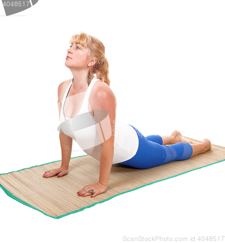 Image of Yoga trainer lying on stomach.