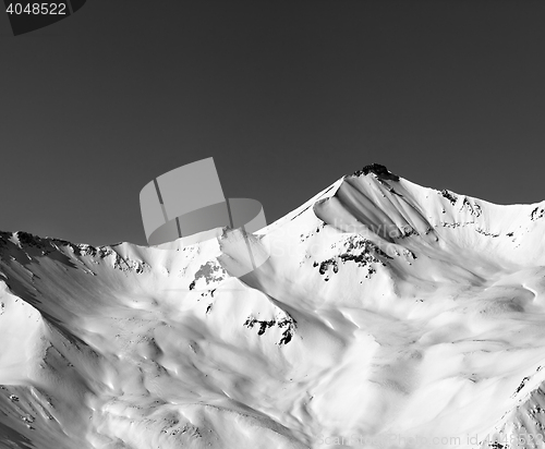Image of Black and white off-piste snowy slope in winter mountain