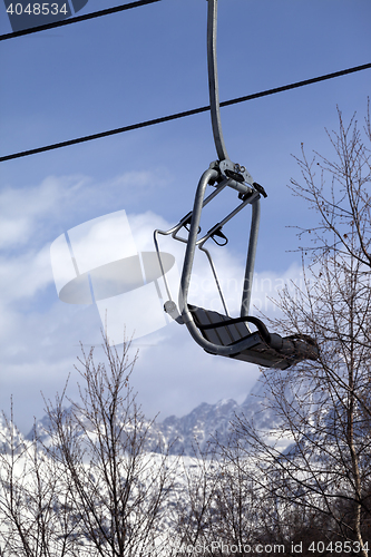 Image of Ski lift in snow mountains at nice winter day