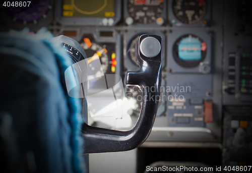 Image of Center console and throttles in airplane