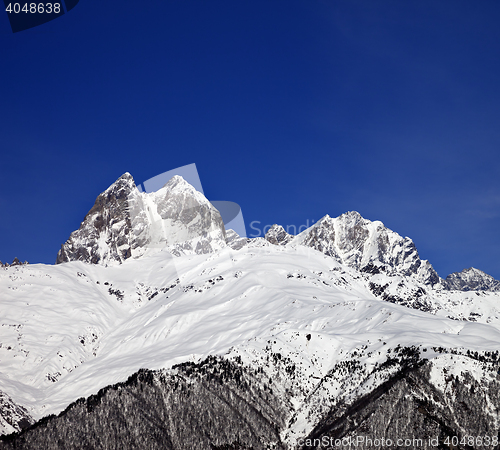 Image of Mount Ushba in winter at sun day