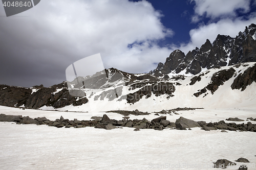 Image of Snow mountain and gray clouds before storm