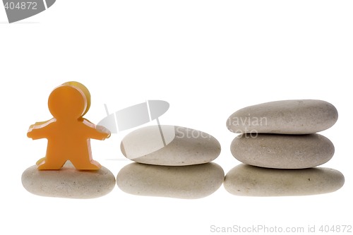 Image of Figurine on stack of pebble