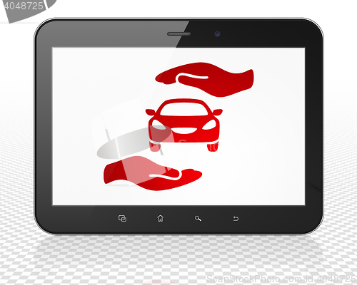 Image of Insurance concept: Tablet Pc Computer with Car And Palm on display