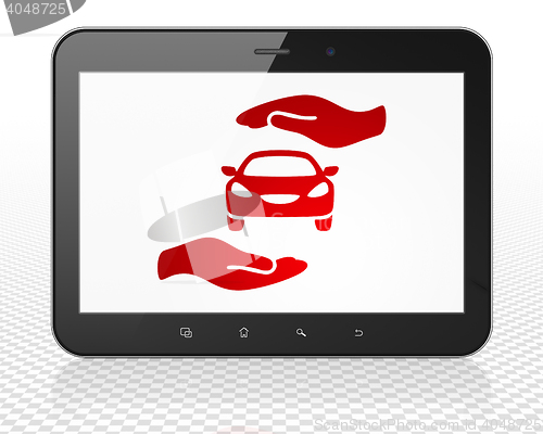 Image of Insurance concept: Tablet Pc Computer with Car And Palm on display