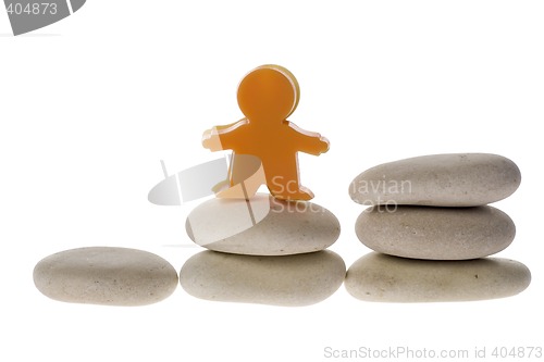 Image of Figurine on stack of pebble