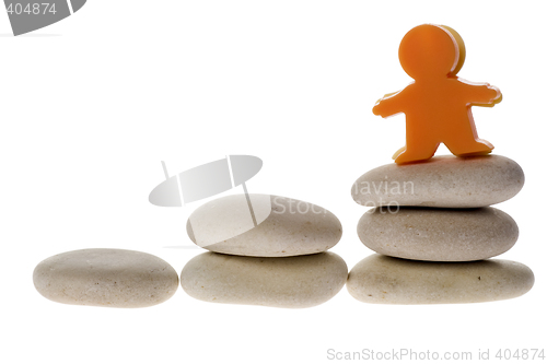 Image of Figurine on stack of pebble