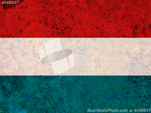 Image of Flag on rusty metal