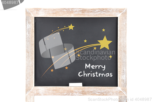 Image of Christmas greetings with comets on blackboard