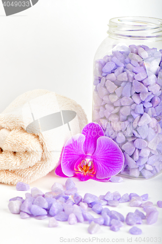 Image of Salt, towel and orchid