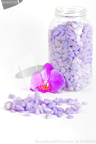 Image of Salt in the bottle and orchid flower