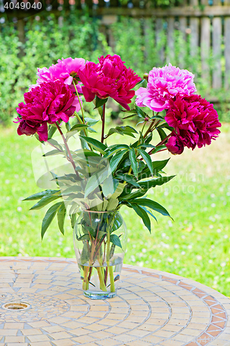 Image of Pink peony flowers in vase