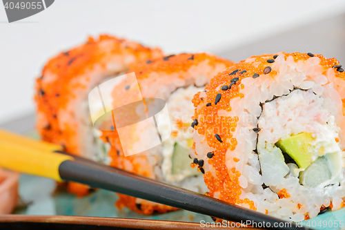 Image of California maki sushi with orange masago